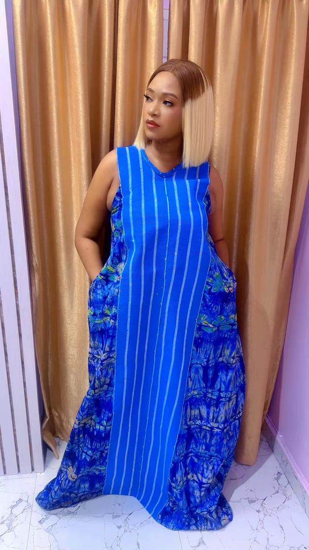 Model wearing the Eveda Trendy Adire Aso-Oke dress in royal blue